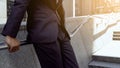 Afro-American office worker standing on stairs near office building, optimism Royalty Free Stock Photo