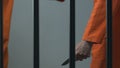 Afro-American prisoner with knife attacking Caucasian cellmate in prison cell