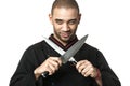 Afro American professional cook holding knifes - isolated. Royalty Free Stock Photo