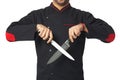 Afro American professional cook holding knifes - isolated. Royalty Free Stock Photo