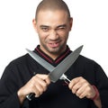 Afro American professional cook holding knifes - isolated. Royalty Free Stock Photo