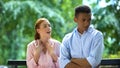 Afro-American teen boy tired of listening girlfriends complaints, relationship