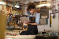 Young woman doing woodwork in a workshop Royalty Free Stock Photo