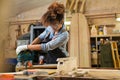 Young woman doing woodwork in a workshop Royalty Free Stock Photo