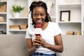 Afro American Woman Enjoying Podcasting with Microphone at Home