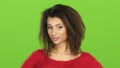 Afro american woman flirts and winks at eye, green screen