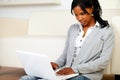 Afro-american young female using her laptop Royalty Free Stock Photo