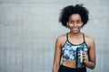 Athletic woman drinking water after work out outdoors. Royalty Free Stock Photo