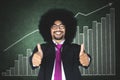 Afro businessman with financial graph Royalty Free Stock Photo