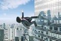 Afro businessman running upward on a skyscraper