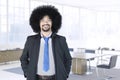 Afro businessman standing in office