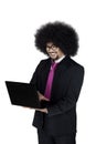 Afro businessman using a laptop in studio Royalty Free Stock Photo