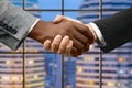 Afro and caucasian businessmen's handshake.