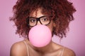 Afro girl blowing bubble gum balloon. Royalty Free Stock Photo