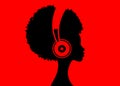 The Afro girl listens to music on headphones. Music therapy. Profile of a young African American woman. Musician avatar side view.