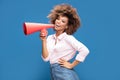 Afro girl screaming by megaphone. Royalty Free Stock Photo