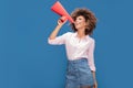 Afro girl screaming by megaphone. Royalty Free Stock Photo