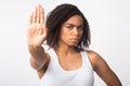 Afro girl showing stop sign on white background