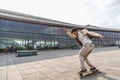 Afro guy rides and doing turn on his skateboard