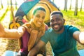 afro latin couple in tent taking selfie using modern smartphone Royalty Free Stock Photo