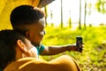 afro latin couple in tent taking selfie using modern smartphone Royalty Free Stock Photo