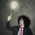 Afro male entrepreneur and light bulb Royalty Free Stock Photo