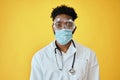 Afro Male Surgeon Wearing Protective Face Mask And Eyewear Royalty Free Stock Photo