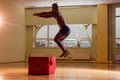 Afro man doing exercise with a fit box in a gym Royalty Free Stock Photo