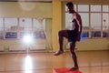 Afro man doing exercise with a fit box in a gym Royalty Free Stock Photo