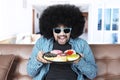Afro man holds tasty donuts