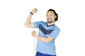 Afro man measuring his bicep on studio Royalty Free Stock Photo