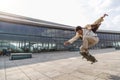 Afro man skateboarder flies in air on skateboard Royalty Free Stock Photo