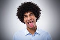 Afro man sticking tongue out Royalty Free Stock Photo