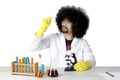Afro scientist looking at a microscope slide Royalty Free Stock Photo
