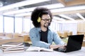 Afro student listening music with a headphone Royalty Free Stock Photo