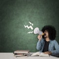 Afro student looks stressful in the classroom