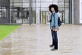 Afro student shows thumb up at school