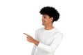 Afro teenager with with afro hair pointing something with his finger
