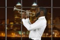 Afro trumpeter playing music.