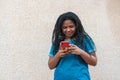 Afro woman writing a cell phone message Royalty Free Stock Photo