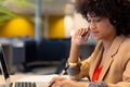 Afro young african american businesswoman with headset using laptop at modern workplace Royalty Free Stock Photo