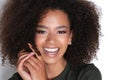 Afroamercian young woman in dark green dress on white background.