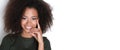 Afroamercian young woman in dark green dress on white background.