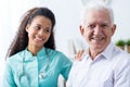 Afroamerican caregiver and old man Royalty Free Stock Photo