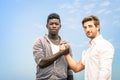 Afroamerican and caucasian men shaking hands Royalty Free Stock Photo