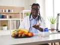 Afroamerican nutritionist looking at camera