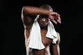 Afroamerican sports man with white towel on his shoulders resting after workout Royalty Free Stock Photo