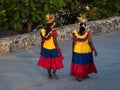 Afrocolombian women fruit vendor seller in colombian colored dress skirt costume walking in Cartagena de Indias Colombia Royalty Free Stock Photo