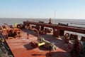 Aft stern mooring maneuvering station of cargo container vessel with winches, bollards, ropes. Ship is without containers. Royalty Free Stock Photo