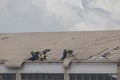 Aftermath Cyclone Idai and Cyclone Kenneth in Mozambique and Zimbabwe, people fixing damaged roof Royalty Free Stock Photo